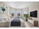 Main bedroom with large windows and room for a king-size bed at 10551 Tranquil Meadow Loop, Riverview, FL 33569