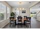 Dining area with a live-edge wood table and modern chairs at 10551 Tranquil Meadow Loop, Riverview, FL 33569
