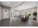 Open dining room with wood table and gray tile floors at 10551 Tranquil Meadow Loop, Riverview, FL 33569