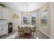 Breakfast nook with a round table and neutral chairs at 10551 Tranquil Meadow Loop, Riverview, FL 33569