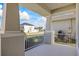 Front porch with white railing and view of neighborhood at 10551 Tranquil Meadow Loop, Riverview, FL 33569