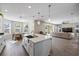 Open floorplan showing modern kitchen and living room at 10551 Tranquil Meadow Loop, Riverview, FL 33569