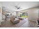 Spacious living room with open concept floor plan and kitchen view at 10551 Tranquil Meadow Loop, Riverview, FL 33569