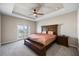 Large main bedroom with private balcony access at 10551 Tranquil Meadow Loop, Riverview, FL 33569