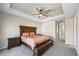 Main bedroom with carpeted floor and ensuite bathroom at 10551 Tranquil Meadow Loop, Riverview, FL 33569