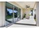 Covered patio with ceiling fan, sliding glass doors, and potted plants at 10551 Tranquil Meadow Loop, Riverview, FL 33569