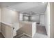 Upstairs hallway with access to bedrooms and a bonus room at 10551 Tranquil Meadow Loop, Riverview, FL 33569
