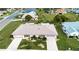 Single-story home with landscaped yard and driveway at 1623 Faxton Dr, Sun City Center, FL 33573