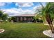 Large grassy backyard with screened enclosure at 1623 Faxton Dr, Sun City Center, FL 33573