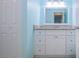 Clean bathroom with a single sink vanity and granite countertop at 1623 Faxton Dr, Sun City Center, FL 33573
