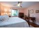 Bright bedroom featuring a king-size bed and ample storage at 1623 Faxton Dr, Sun City Center, FL 33573