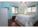 Cozy bedroom with a queen-size bed and light blue walls at 1623 Faxton Dr, Sun City Center, FL 33573