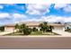 Single-story home with a landscaped front yard and two-car garage at 1623 Faxton Dr, Sun City Center, FL 33573