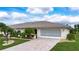Single-story home with a two-car garage and well-maintained lawn at 1623 Faxton Dr, Sun City Center, FL 33573