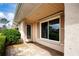 Front entrance with a sliding glass door and shutters at 1623 Faxton Dr, Sun City Center, FL 33573
