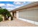 Two-car garage with a large screened enclosure at 1623 Faxton Dr, Sun City Center, FL 33573