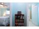 Hallway with built-in bookcase, providing extra storage at 1623 Faxton Dr, Sun City Center, FL 33573