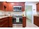 Modern kitchen with granite countertops and stainless steel appliances at 1623 Faxton Dr, Sun City Center, FL 33573