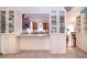 Open kitchen with breakfast bar and built-in shelving at 1623 Faxton Dr, Sun City Center, FL 33573