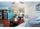 Open living area with hardwood floors, teal accent wall, and comfortable seating at 1623 Faxton Dr, Sun City Center, FL 33573