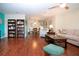 Spacious living area with hardwood floors, built-in shelving, and comfortable seating at 1623 Faxton Dr, Sun City Center, FL 33573
