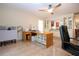 Spacious office with large desk and view of kitchen at 1623 Faxton Dr, Sun City Center, FL 33573