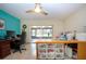 Bright office space with plenty of natural light and a ceiling fan at 1623 Faxton Dr, Sun City Center, FL 33573