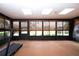 Spacious sunroom with a treadmill and plenty of natural light at 1623 Faxton Dr, Sun City Center, FL 33573