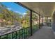 Private balcony overlooks a tree-lined street at 3031 Countryside Blvd # 25C, Clearwater, FL 33761