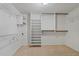 Ample closet space with wire shelving and hanging rods at 3031 Countryside Blvd # 25C, Clearwater, FL 33761