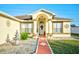 Single-story home with a fountain and landscaped front yard at 3314 Beaver Ave, Spring Hill, FL 34609