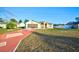 Single-story home with a reddish-brown driveway and lawn at 3314 Beaver Ave, Spring Hill, FL 34609