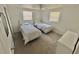 Cozy bedroom with two twin-size beds, offering ample space at 4718 Blossom Dr, Holiday, FL 34690