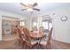 Spacious dining area with kitchen view, sliding doors to patio, and wood dining table at 502 Hilldale Rd, Brandon, FL 33510