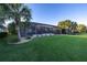 Screened patio and pool area with lush landscaping at 5608 Tidewater Preserve Blvd, Bradenton, FL 34208