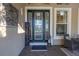 Elegant front door entrance featuring decorative glass, stylish decor, and a cozy seating area at 5608 Tidewater Preserve Blvd, Bradenton, FL 34208