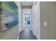 Hallway with tile floors and a view of a bathroom at 5608 Tidewater Preserve Blvd, Bradenton, FL 34208