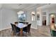 Dining room with wood table, gray chairs, and a chandelier at 5908 30Th E Ct, Ellenton, FL 34222