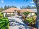 Single-story home with a landscaped yard and driveway at 5908 30Th E Ct, Ellenton, FL 34222