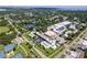 Aerial view of San Troy Plaza, highlighting its location near tennis courts and a lake at 6100 12Th S St # 219, St Petersburg, FL 33705