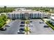 Aerial view of San Troy Plaza, showcasing building, parking and pool at 6100 12Th S St # 219, St Petersburg, FL 33705