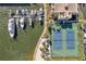 Aerial view showing tennis courts, marina, and waterfront at 7400 Sun Island S Dr # 203, South Pasadena, FL 33707