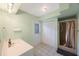 Bathroom with shower, vanity, and exterior access at 8254 40Th N Ave, St Petersburg, FL 33709