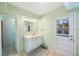 Bathroom with vanity, mirror, and access to another room at 8254 40Th N Ave, St Petersburg, FL 33709
