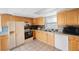 Kitchen features wood cabinets, tile floors, and stainless steel appliances at 8254 40Th N Ave, St Petersburg, FL 33709