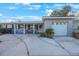 Ranch-style home with attached garage and porch at 8254 40Th N Ave, St Petersburg, FL 33709