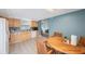 Eat-in kitchen with light wood cabinets and tile floor at 8254 40Th N Ave, St Petersburg, FL 33709