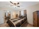 Bedroom includes a queen bed, ceiling fan, and mirrored closet doors at 8254 40Th N Ave, St Petersburg, FL 33709