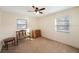 Bedroom with ceiling fan, dresser, and bench at 8254 40Th N Ave, St Petersburg, FL 33709