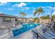 Relaxing pool area with ample lounge chairs at 8254 40Th N Ave, St Petersburg, FL 33709